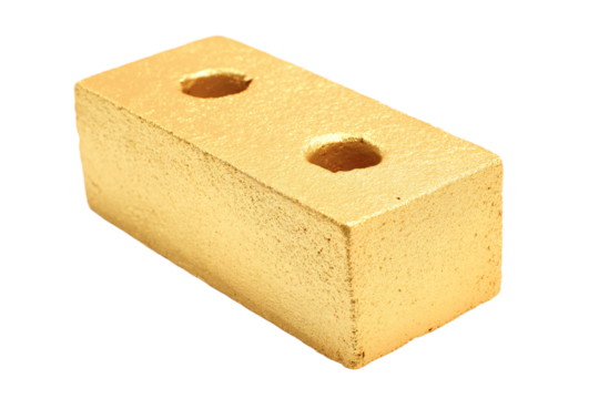 a gold colored brick with holes in it