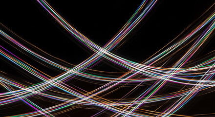 Abstract futuristic background with intersecting lines of colorful light, a generated visualization of flowing digital energy and data streams.