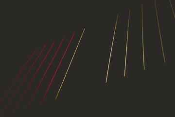 Two lines of red and yellow are shown on a dark background