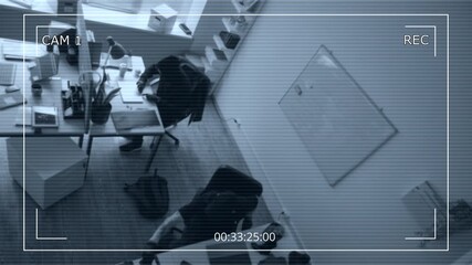 Security camera footage of two male criminals wearing masks hacking into corporate laptops while breaking into office during industrial espionage - Powered by Adobe