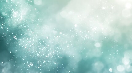 Abstract teal blue bokeh background with glowing glitter. Festive sparkling lights design