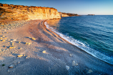 Sunset on the bay beach. White River Beach, Peyia, Cyprus. The most beautiful beach in Cyprus.
