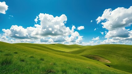 Rolling green hills under a bright blue sky with fluffy white clouds
