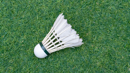 White Badminton Shuttlecock On Green Grass