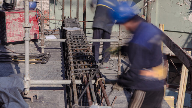 Steel bar rebar metal framework reinforcement for concrete at construction site timelapse.
