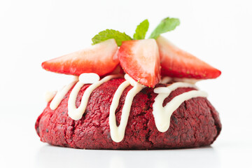 Fresh chocolate American red chip cookie decorated with strawberries and mint on white background. Close up of cookies with red velvet chocolate dough