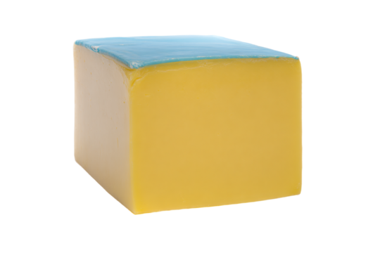 a yellow and blue block of soap on a white background