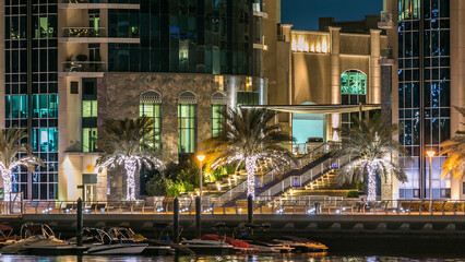 Obraz premium Promenade in Dubai Marina timelapse at night, UAE.