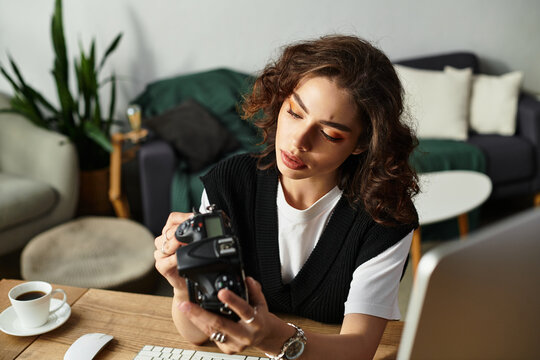 Young woman with curly hair engaged in creative process at home workspace