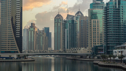 Obraz premium View of Dubai Marina towers and canal in Dubai morning timelapse