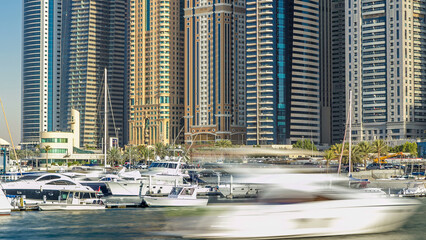 Close up view of Dubai Marina tallest towers in Dubai at day timelapse