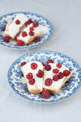 Raspberry ice cream in white bowl close up