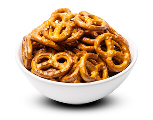 Small traditional beer pretzels with salt in a white ceramic bowl isolated on white background
