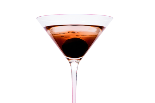 a glass of wine with a black olive in it