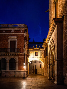 Twilight view of Calle de la Barchilla in Valencia&rsquo;s Ciutat Vella, Spain&mdash;historic facades glow under lamplight, capturing the charm of old Europe.