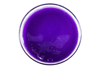 Obraz premium a glass of purple liquid with a white background