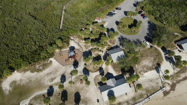 Drone orbits left in bird's eye view of Robert K Rees Memorial Park in the late afternoon in Florida, USA