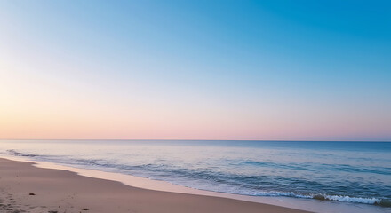 A serene beach landscape unfolds with gentle waves meeting the shore under a pastel-colored sky.