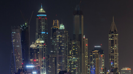 Aerial top view at night timelapse of Dubai Marina in Dubai, UAE