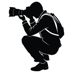 Photographer crouching with camera silhouette black and white
