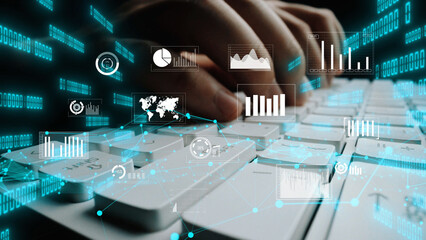 This image depicts hands typing on a keyboard with an array of digital data visualization elements. It symbolizes technology, analysis, and modern data-driven insights. Xenic