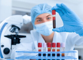 Medical worker making blood test for detection of antibodies and infections in modern laboratory,...