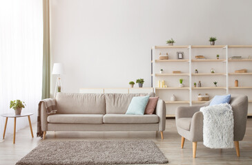 Contemporary real estate for sale, rent and blog of interior. Sofa with pillows and blanket, table...