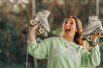 figure skating athlete with skates smiling outdoors