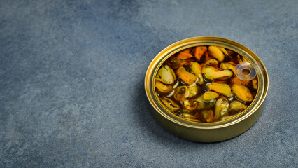 Canned mussels in a metal jar. Canned food in aluminum cans.