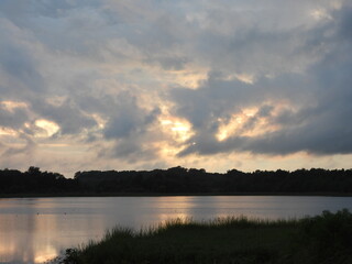 The tranquil beauty of the wetlands, as the sun sets. Bombay Hook National Wildlife Refuge, Kent County, Delaware. Remnants of tropical storm Debby.