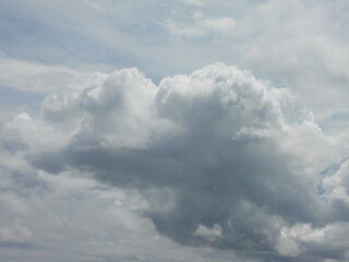 Cumulonimbus clouds, thunderheads forming within a blue sky, over Kent County, Delaware. Cloudscape.