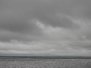 A ship makes its way through Delaware Bay and River shipping channel, during a stormy day, as seen from the Bombay Hook National Wildlife Refuge, Kent County, Delaware.