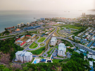 Aerial view of the city in Trinidad and Tobago. It showcases devlopment in the Caribbean. Highways, roads, buildings etc. 