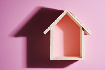 small model house with hard shadow.