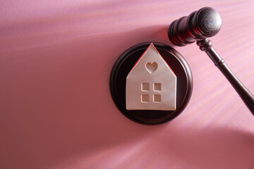 gavel hammer and model house