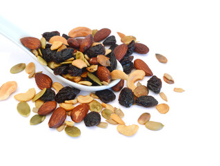 Mix nuts, dry fruits and grapes on a white background