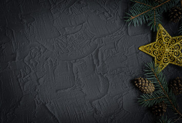 Christmas or New Year dark stone background, Xmas black board framed with season decorations, space for a text, view from above