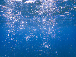 Air bubbles underwater rising to water surface, natural scene, bubbles under water, bubble undersea, sea in crystal clear green water. Real image very suitable for backgrounds, Great for background.