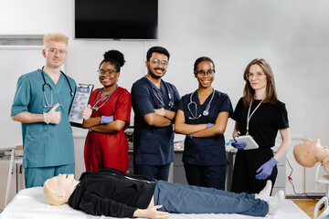 Medical Students Practicing CPR on a Medical Dummy during First Aid Training