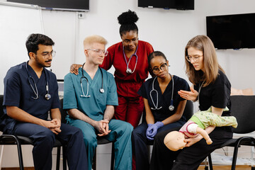 Medical Students Learning Infant CPR during Training Session