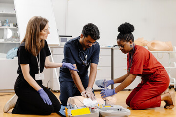 Medical students practicing cardiopulmonary resuscitation during training