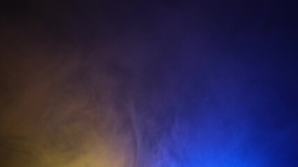 Abstract background of yellow and blue smoke gradient slow motion