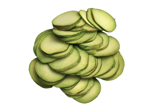 a pile of sliced green apples on a white surface