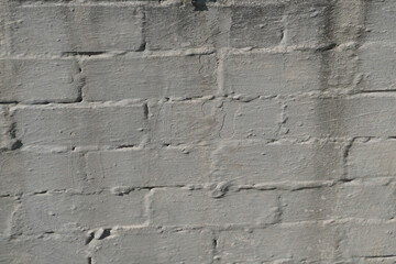 текстура белой кирпичной стены при дневном свете.