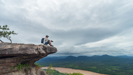 Tourists watch the atmosphere, sky and clouds above the Mekong mountain at Pha Chanadai. Ubon Ratchathani, Thailand