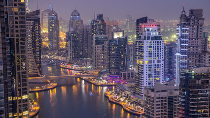 Beautiful aerial top view day to night transition timelapse of Dubai Marina canal