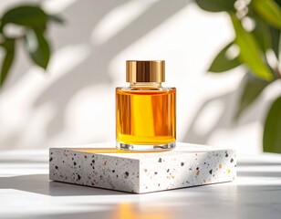 Perfume bottle with golden cap on terrazzo stand with leaf shadows in soft focus background