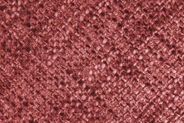 Macro, close up of red woven burlap fabric, cloth texture with thick threads and rough textile...