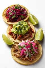 A trio of tacos with vibrant fillings carnitas, guacamole, red onion and lime wedges, a vibrant street food style.