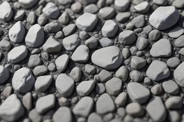 A close up of a rocky surface with a variety of sizes and shapes of rocks. Concept of ruggedness and natural beauty, with the rocks scattered across the surface in a seemingly random pattern
